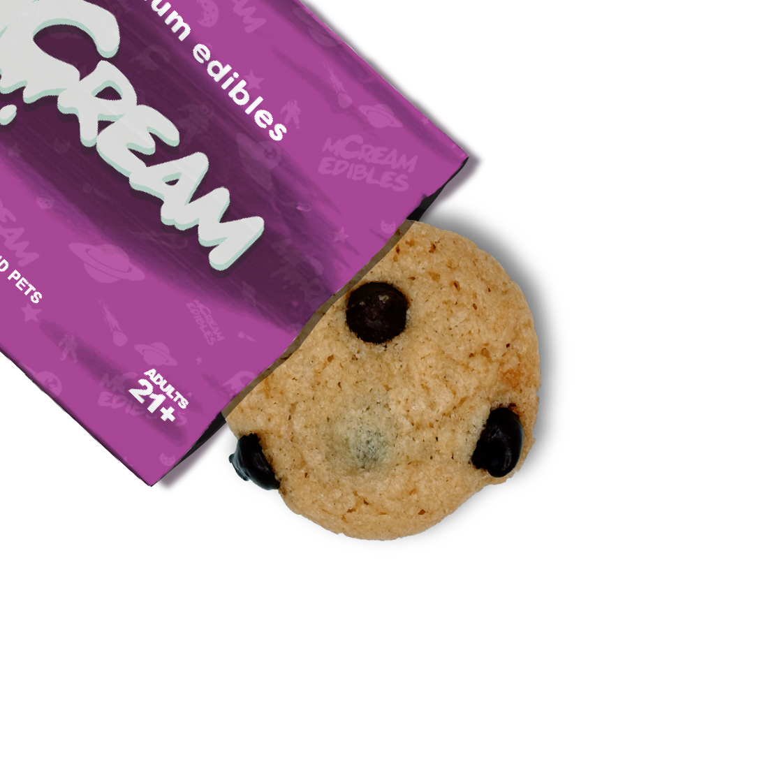 mCream THC-infused chocolate chip cookie partially shown with signature purple edibles pouch